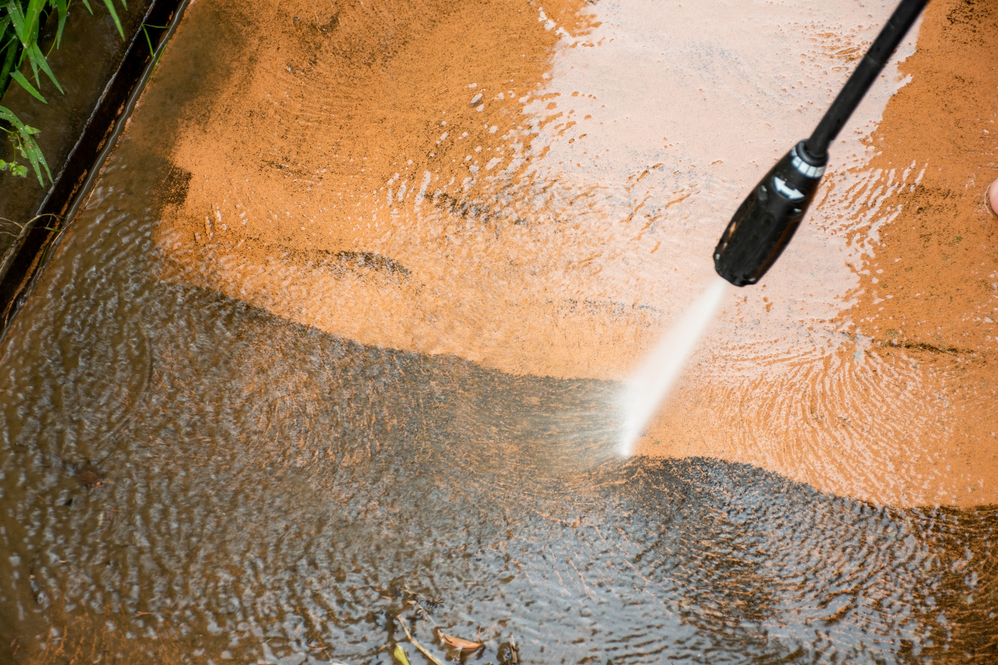 Cleaning backyard with pressure washer clelaner. Spring clean up, Pressure Washing Services in Elyria